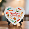 Heart-shaped decorative plaque with candy-themed design and 'Grandma's Sweets' text on a stand.
