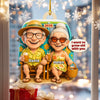 Decorative ornament with cartoon elderly couple named David and Helen, sitting on a bench with 2025 text, surrounded by festive lights and snowflakes.